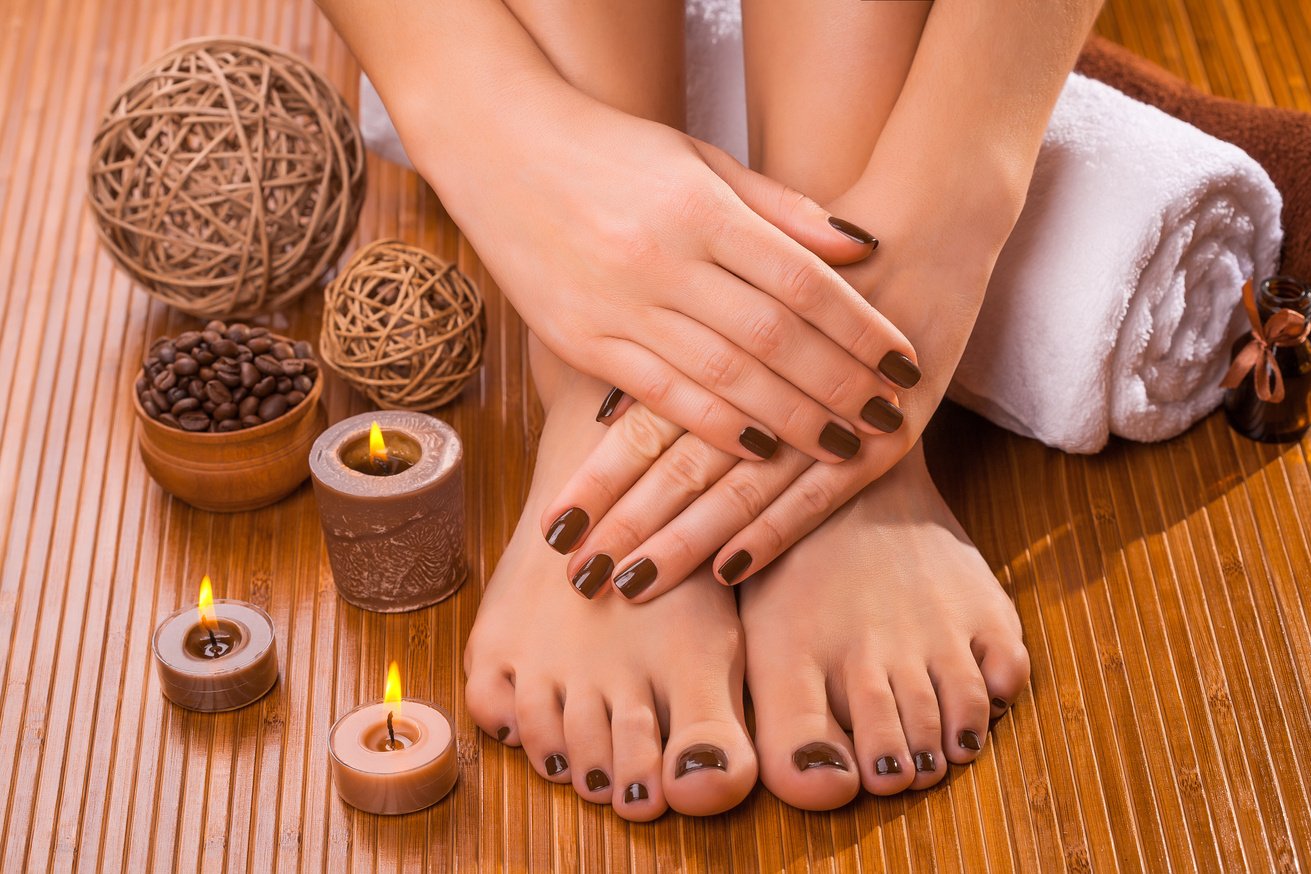 beautiful brown manicure and pedicure on the bamboo